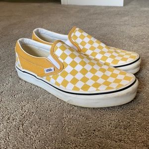 Vans yellow checkered slip ons